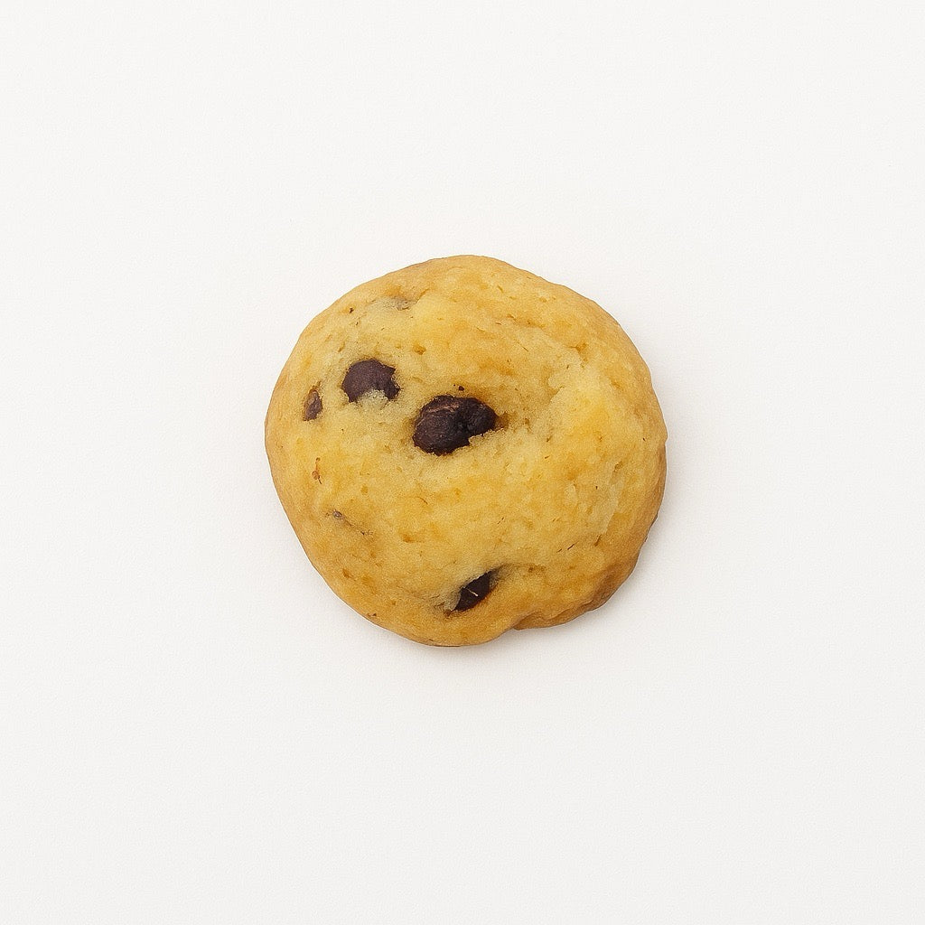 Old recipe mini chocolate chip cookie top view on white background